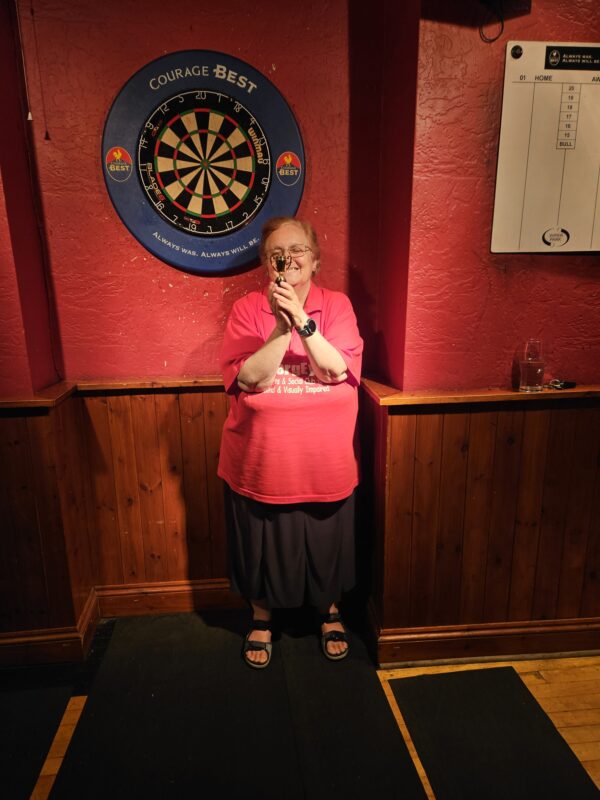 JAYNE COOPEY HIGHEST FEMALE SCORER. TRYING TO HIDE BEHIND HER TROPHY