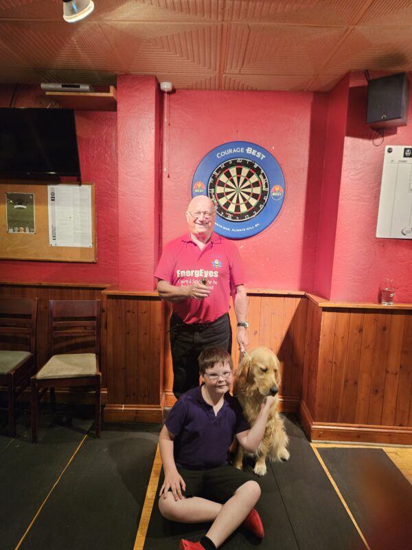 DAVID BARBER HIGHEST MALE SCORER WITH HIS GUIDE DOG FINCHAND SAM A VOLUNTEER SAT IN FRONT OF DAVID